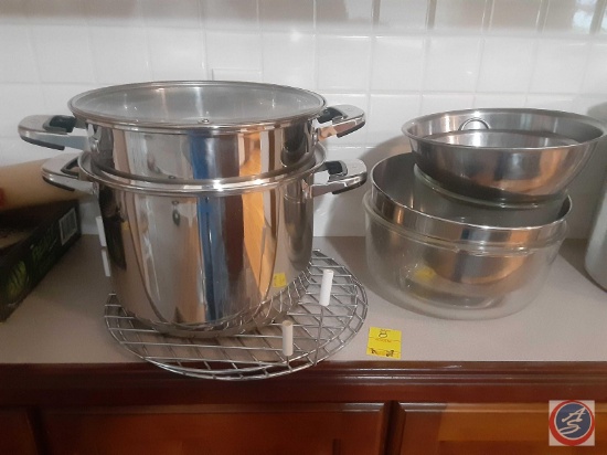 A steam pan two glass bowls 3 metal bowls and two cooling racks