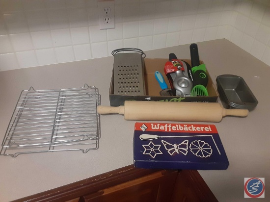 Assorted utensils and two cooling racks, three mini loaf pans.