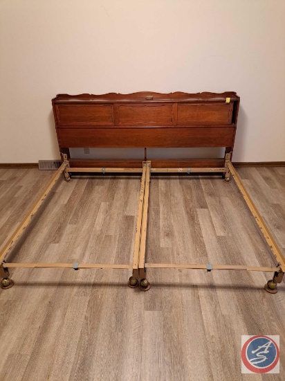 Bed frame with storage sliding doors on the headboard, there are wheels on the frames legs. Measures