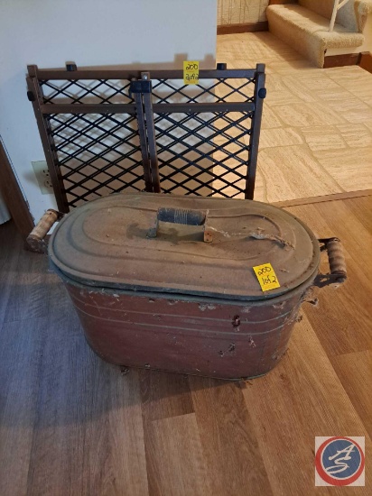 Expandable baby gate, and vintage copper boiler with lid.