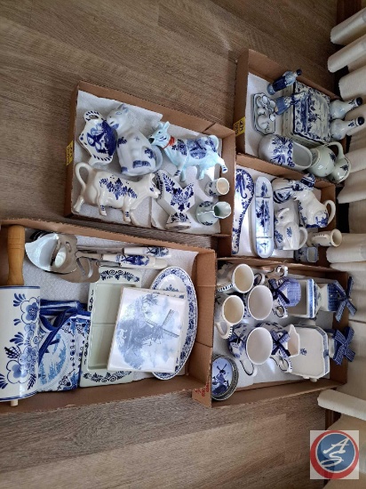 Large assortment of Delft blue dishes. Including serving utensils, cream dishes, salt and pepper