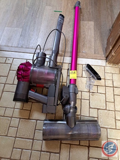Dyson cordless handheld vacuum with attachments.