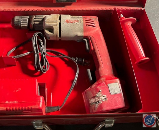 Milwaukee hammer drill in a case with charger and battery