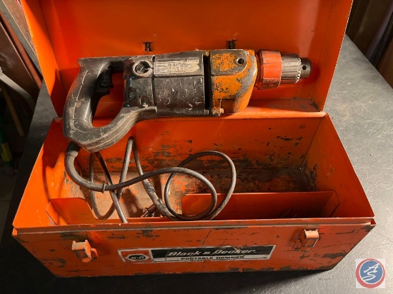 Black & Decker electric hammer drill with extra bits in a case