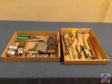 Pliers, hammers, pipe wrench, assorted wrenches, pry bar, sockets, drill bits, vise grip, ratchet,