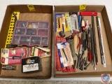 Ignition spark tester, drill bits, jigsaw blades, files, rotary bits, locking fuel cap, fuses, screw