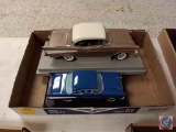 Diecast cars on stands