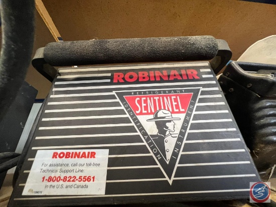 Robinair Refrigeration Identification System, AC Unit, small table grill, and orange sign