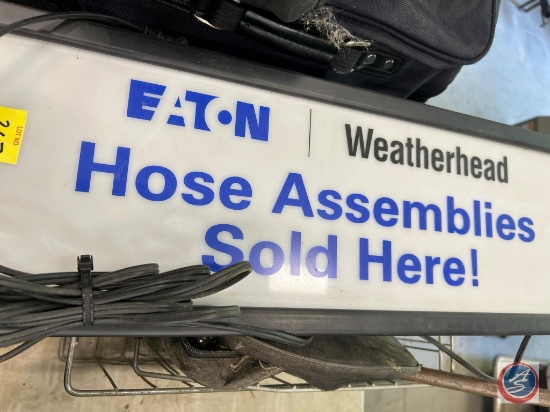 Electric sign "Eaton Weatherhead Hose assemblies sold here"... flash light, and bag.