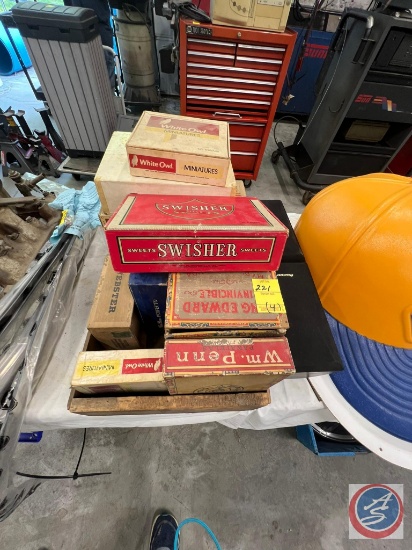 cigar boxes, pioneer stickers, and blue and yellow napa hat