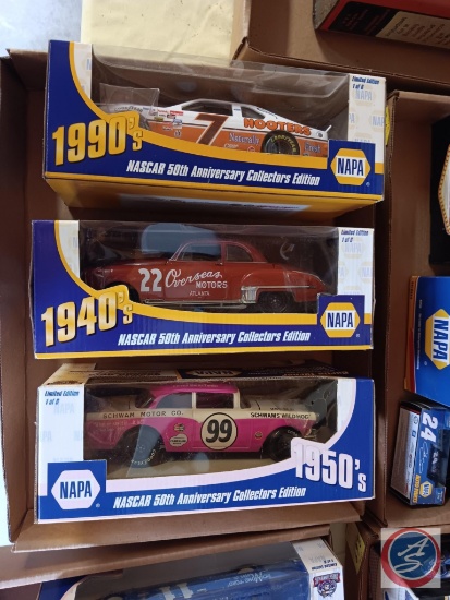 Three napa model cars, Alan Kulwicki # 7, Red Byron # 22, and Curtis Turner #99
