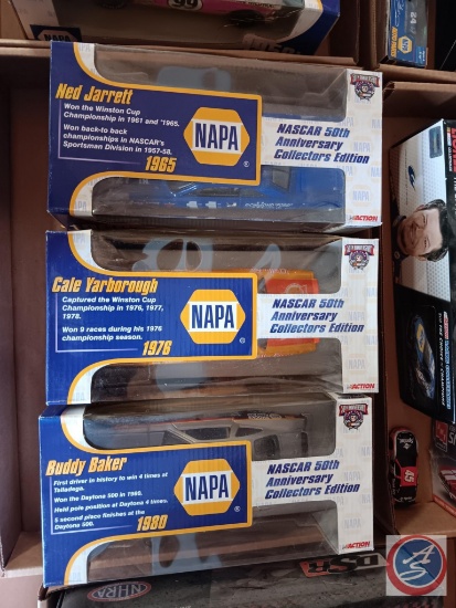 Three NAPA model cars, including Ned Jarrett # 11, Cale Yarborough # 11, and Buddy Baker # 28