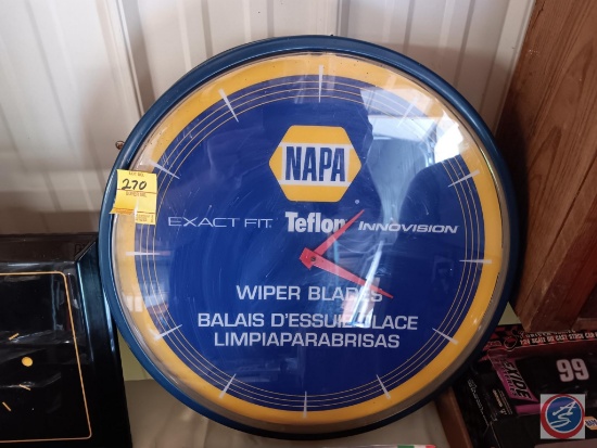 NAPA wall clock has "Exact fit Teflon innovation wiper blades" written on it.