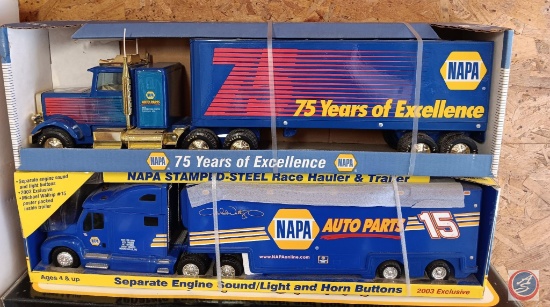 Two NAPA semi trucks and trailer new in box.