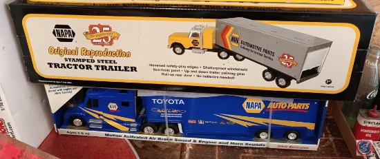 Two Napa semis trucks and tailer, new in box.