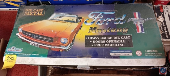 Die cast metal Mustangs, includes, red, yellow, and blue. As well as one other wooden car.