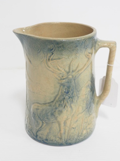 Stoneware pitcher with deer pattern