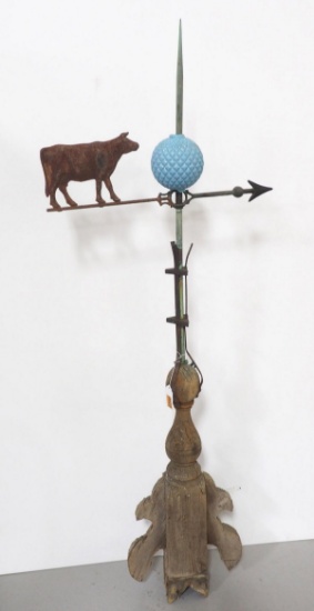 Brass rod, wood base, tin cow arrow & blue ball