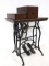Treadle sewing machine with cabinet