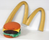 McDonalds M sign with cheeseburger