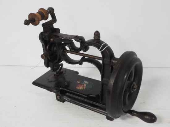 Early cast iron child's sewing machine