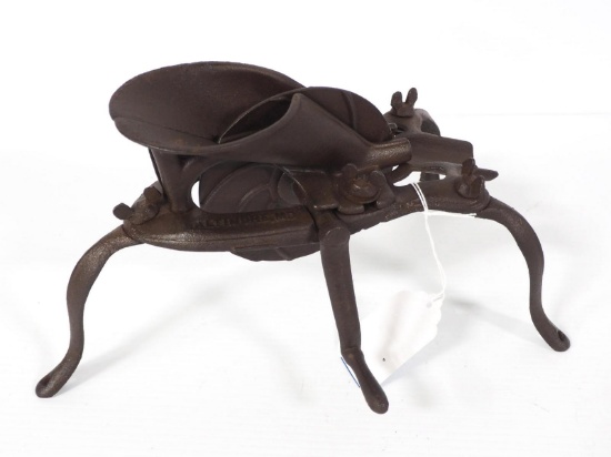 3-legged cast iron cherry pitter