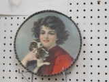 ANTIQUE CIRCULAR METAL PICTURE - GIRL W/ PUPPIES