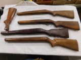 (4) VARIOUS GUN STOCKS & A BUTT STOCK