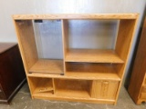 LIGHT COLORED PRESSED WOOD ENTERTAINMENT CENTER