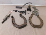 HORSE SHOES, HOOKS, CAST IRON WOMAN ON STOOL