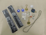 (2) EIGER WRIST WATCHES & ASSORTED KEY CHAINS, HAT PINS & NECKLACE