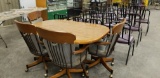 MAPLE COLORED KITCHEN TABLE W/ 4 CHAIRS ON ROLLERS
