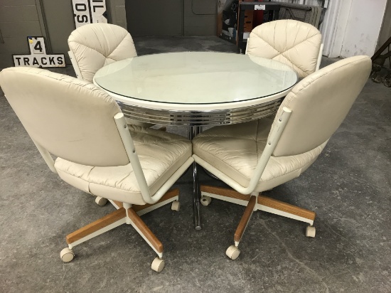 CHROME TABLE W/4 ROLL AROUND PADDED CHAIRS
