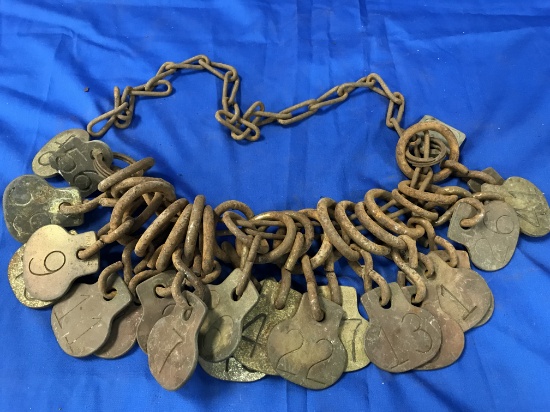 (22) NUMBERED BRASS ANIMAL TAGS ON CHAIN