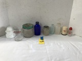 ASSORTED BOTTLES AND SHAVING CREAM CONTAINERS