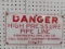 PORCELAIN CONTINENTAL PIPE DANGER SIGN