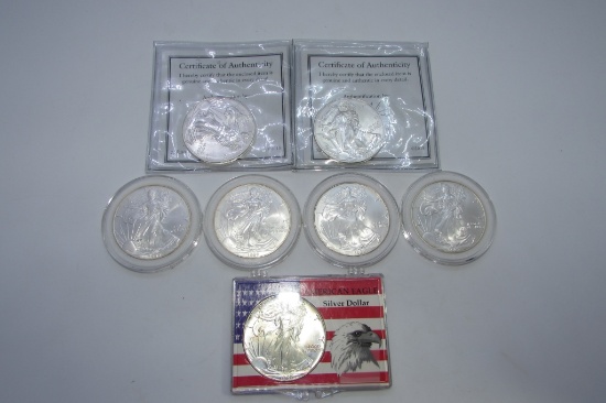 7 UNCIRCULATED US SILVER EAGLE COINS