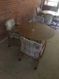 Round Ratan Table and Three Well Worn Chairs