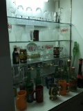 Shelf Behind Bar with Nice Collecton of Glasses and More
