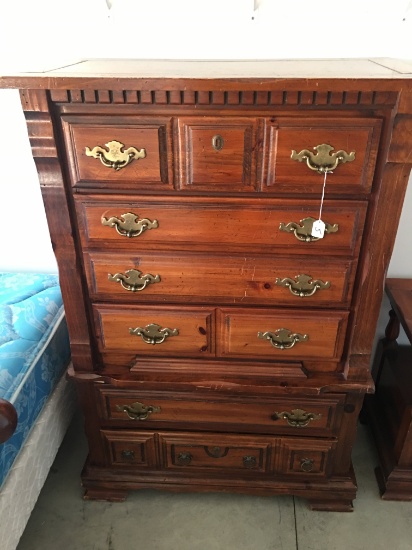 Pine Chest of Drawers that Shows Wear from Years of Use