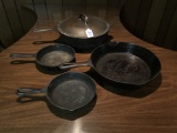 Two Number 3 and Two Number 8 Cast Iron Skillets