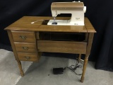 Singer Sewing Machine In Cabinet