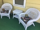 Two Wicker Chairs and a Small Table