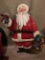 Embossed Tin Hand Painted Santa On Stand Is 34