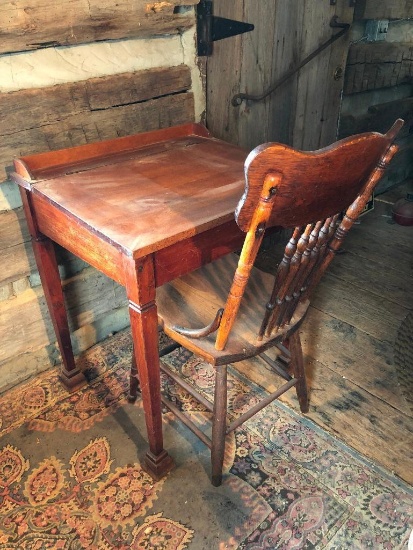 Antique ladies writing desk with press back chair.