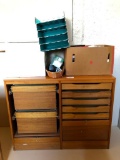 Office Storage Unit with Missing Doors and Group of Office Supplies