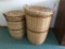 Pair of wicker laundry baskets that have seen use, taller one is 2 feet tall