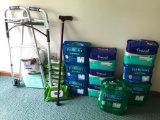 Large group of Medium adult Diapers, aloe wipes, walker and cane