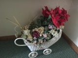 Small wicker carriage with flowers