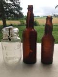 An Atlas E-Z Seal Mason Jar and Two Cincinnati Brewing Co. Bottles.